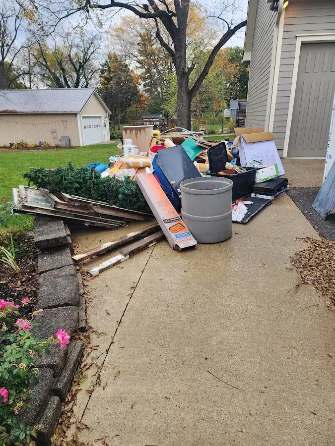 Dumpster being loaded with debris for 12 Yard Dumpster Rental in Harrisburg